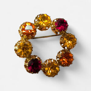 Vintage Austria Signed Red Orange Rhinestone Circle Wreath Gold Tone Pin Brooch